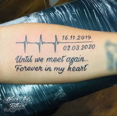 a person with a tattoo on their arm that says, what we meet again forever in my heart