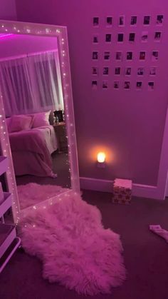 a room with a bed, mirror and lights on the wall in it's corner