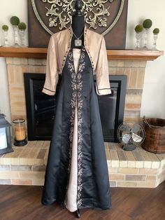 "This is a designer Renaissance dress with incredible black satin and champagne fabric. Lots of ornate trim.  Gemstones trim out jacket along with satin bows. Zips up back. Pewter necklace with cross gemstones finish this masterpiece. Chest 36-38\", waist 30-32\", length 58\". You will never see another like this." Elegant Embellished Satin Mother Of The Bride Dress, Ball Gown Medieval, Champagne Fabric, Burgundy Formal Dress, Necklace With Cross, Armor Dress, Medieval Dress, Apron Dress, Yes To The Dress