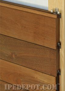 a close up of a wooden door with metal handles