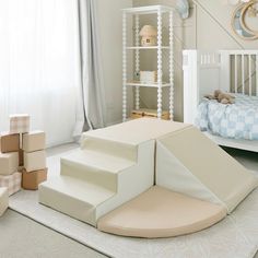 a child's bedroom with white furniture and accessories on the floor, including a bed