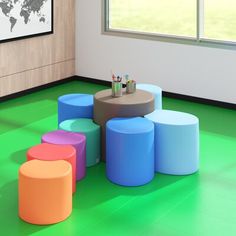 colorful stools and tables in a room with a world map on the wall behind them