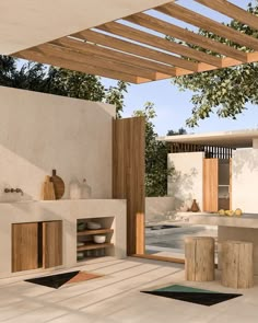 an outdoor kitchen is shown with wood accents