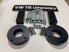 an assortment of hardware and screws are displayed on a white surface with the words vw ts upgrades above it