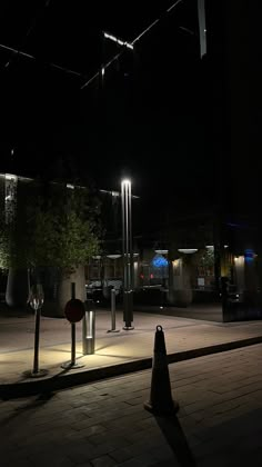 an empty parking lot at night with street lights