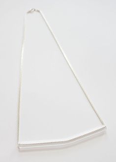 Minimal Glass Tube Necklace No. 5- Each piece is handmade producing similar yet one of a kind results. - Borosilicate glass tube with slight bend. Measures approx. 4". - Displayed on your choice of gold or silver plated brass chain. Measures 22". See more of my glass necklaces here: https://www.etsy.com/shop/UrbanRevisions?section_id=12314363-------------------------------------------------------------------Made to order : product will ship within 7 business days. Please read shop policies befor Tube Necklace, May 31, No 5, Brass Chain, Glass Necklace, Bend, Arrow Necklace, Silver Plate, Gold Necklace