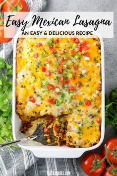 an easy mexican lasagna casserole in a white dish with tomatoes and parsley on the side