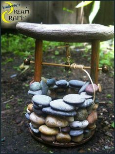 a small stool made out of rocks sitting on the ground