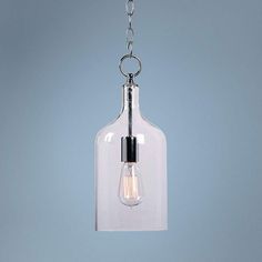 a clear glass light hanging from a chain on a gray wall with a white background