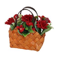 a basket filled with red flowers and greenery