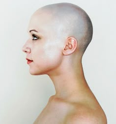 an image of a woman with shaved hair