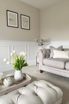 a living room filled with furniture and flowers