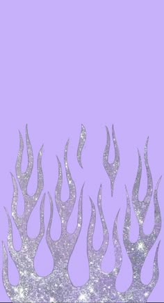 a purple background with silver fire flames on the bottom, and white stars in the middle