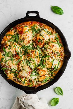 a pizza sitting on top of a pan covered in cheese and vegtables