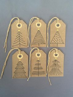 six tags with christmas trees drawn on them