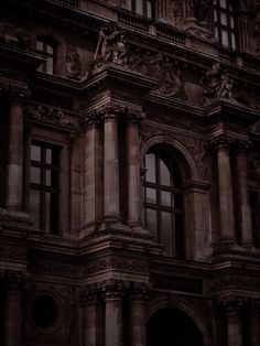 an old building is lit up at night