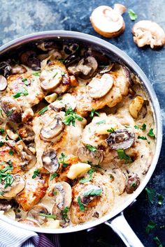 chicken with mushrooms and parsley in a pan