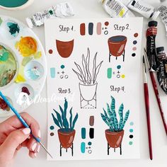 someone is painting some plants in pots on the table with watercolors and paintbrushes