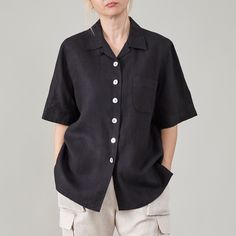 Discover the perfect blend of classic style and modern comfort with our vintage 100% linen shirt in solid black, designed for women size S - M. This short sleeve blouse features a simple, clean design with a relaxed fit, ideal for those who appreciate timeless elegance. Key Features: - 100% linen fabric for ultimate comfort and breathability - Short sleeves for a relaxed, casual look - One chest pocket for added convenience - Contrasting mother of pearl buttons for a premium, natural touch While Linen Black Shirt, Black Linen Shirt, Handmade Pants, Noir Uni, Collared Shirts, Casual Ootd, Black Shirts Women, Fitted Blouses, I Understand