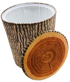 a tree stump with a white cup in the center and woodgrain around it