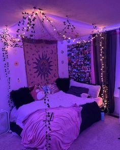 a bedroom with purple lights and decorations on the walls