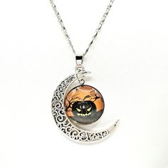 Fiery Jack O'lantern Necklace With Crescent Moon. Silver Alloy. New. Haunted House, Trick-Or-Treat, Jack-O’-Lantern, Halloween, October, Pumpkin, Afraid, Evil, Eerie, Gruesome, Spooky, Broomstick, Witch, Ghost, Nightmare, Cauldron, Frightening, Scary, Darkness, Horrify, Disguise, Petrify, Terrify, Tombstone, Cobweb, Cemetery, Ghoulish, Hocus Pocus, Dead, Haunt, Howl, Dress-Up, Candy, Superstition, Supernatural, Cackle, Chilling, Lantern, Monster, Moonlight, Scream, Grave, Vampire, Costume, Flash Italy Necklace, Teal Necklace, Witch Ghost, Vampire Costume, Pearl Necklace Vintage, Halloween News, Crescent Moon Necklace, Cow Skull, Skull Necklace