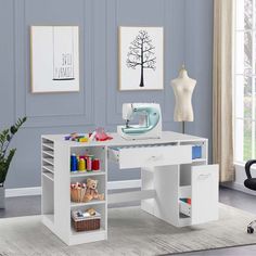 a sewing machine sitting on top of a white desk next to a shelf filled with craft supplies