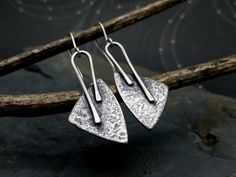 "What happens when edgy industrial meets rustic bohemian style? A fabulous pair of earrings! This unique pair of hammered silver earrings offer an organic, bohemian look as well as a bit of industrial edge. They're the perfect accessory to compliment any occasion from a day at the office taking on the world to a weekend getaway in the woods! These beauties will be on-trend for years to come. I cut rounded triangles out of sterling silver sheet, give them a luscious hammered texture, solder them Bohemian Hand Forged Metal Earrings, Handmade Edgy Sterling Silver Earrings, Contemporary Hand Forged Metal Earrings, Rustic Hand Forged Earrings, Rustic Hand Forged Silver Earrings, Silver Smithing Jewelry, Earrings Grunge, Keum Boo Jewelry, 925 Earrings