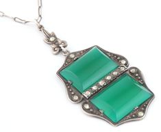 We are pleased to present for your consideration, this fine original Art Deco sterling silver with chrysoprases necklace.  Marked: STERLING and maker's hallmark. Made in Germany, for export. Made of 2 large green chrysoprases, set on sterling silver, decorated with marcasites. Measures: 17 1/2" x 2" (44.5 x 5.0 cm) Weights: 7.4 grams There is a very tiny chip on a stone on this magnificent necklace, what is not noticeable at first sight.  Otherwise, necklace is in very good antique condition.  Look at photos for more details. Will look gorgeous when worn or in collection ! Sterling Silber, Pendant Necklaces, Necklace Etsy, Jewelry Necklace Pendant, Original Art, Art Deco, Germany, Jewelry Necklaces, Accessory Gift