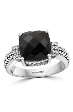 Glinting diamonds accent a sterling silver ring centered with a faceted onyx center stone. Total diamond weight: 0.06ct. Sterling silver/onyx/diamonds 
 Made in the USA Elegant Black Rings With Gemstone Accents, Black Rings With Gemstone Accents, Formal Black Rings With Gemstone Accents, Black Onyx Rings With Diamond Accents, Black Diamond Ring With Diamond Accents In Sterling Silver, Black Onyx Ring, Onyx Ring, Black Onyx, Sterling Silver Ring