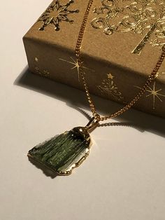 Cute golf charm, gold pendant with real Moldavite - natural gem after a meteorit fall in our country! Greetings from the outer space! Great talisman, best chakra power gem stone, healing stone. Genuine raw moldavite pendant  24k GOLD plated - top quality | Raw Czech Moldavite | Green tektite | Handmade jewelry - directly from Bohemia, Czech Republic - we are based in Bohemia! - Authenticity card included.   One side is perfectly polished to see the best structure of the gem and the other is raw. Moldavite Necklace, Minimalist Gifts, Healing Stones, Gold Pendant, Chakra, Charm Necklace, Gifts For Him, Charms, Gold Necklace