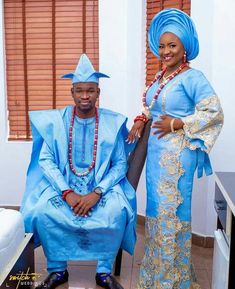 two people dressed in blue standing next to each other