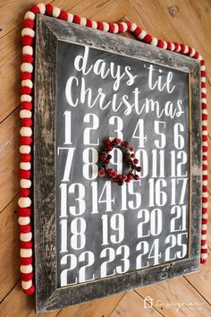 a chalkboard with numbers and a wreath on it that says days the christmas season