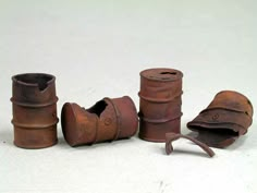 an assortment of old metal objects on a white surface