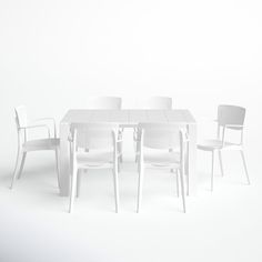 a white table with four chairs around it and one chair on the other side, in front of a white wall