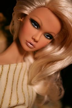 a barbie doll with blonde hair and blue eyes