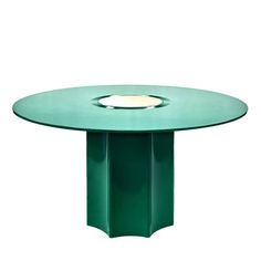 a green table with a white light at the top and an oval shaped center piece