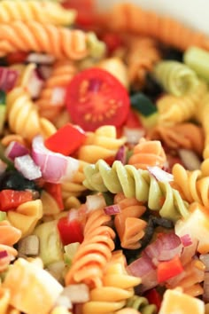 colorful pasta salad in a white bowl