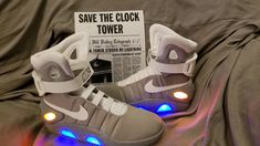 Light Up Air Mag Shoes BACK TO THE FUTURE US Sizes LED Lights Up! With GLOW in the dark straps The shoes you wear say a lot about who you are. Marty McFly's shoes say, I'm a time jumping adventurer with style that's literally ahead of my time. You used to have to borrow a DeLorean time machine from Doc Brown just to get a pair, since they're only available to the alternate reality 2015 seen in the movies. Look no further get yours today! Air Mag Movie Replica Shoes with Nike Add-on Bonus Kit RUB Nike Add, 90s Shoes, Delorean Time Machine, Movie Replica, Pretty Sneakers, Doc Brown, Alternate Reality, Replica Shoes, Light Up Shoes