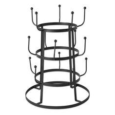 three tiered metal candle holder with four candles on each side and two circular holders in the middle