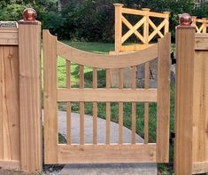 a wooden gate with two gates on each side