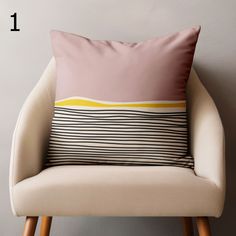 a chair with a pillow on top of it and the number one in front of it