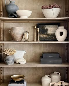 shelves with vases and other items on them