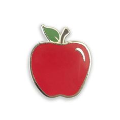 an apple shaped pin with a green leaf on the top and red bottom, sitting in front of a white background