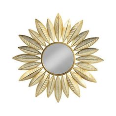 a gold mirror with leaves on it