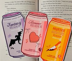 an open book with three stickers on the front and back of it, each depicting different types of beverages