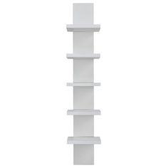 a tall white shelf sitting on top of a wall