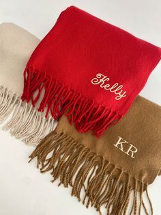 Personalised scarf, monogrammed scarf, winter scarf, wooly scarf. Classic Woven Scarf Soft touch yarn. Oversized design. Tassel trim. Can be personalised with name or initials. The different between Font 3 e Font 4 is the height:  Font 3 - 0.5 inch/ 1.27 cm   Font 4 - 1 inch / 2.54 cm Please confirm the name or initials you would like in the personalisation box and your font choice -  e.g Kelly Font 1 Please note if no font is selected in the personalisation box the order will be made in default Embroidery Scarf Ideas, No Sew Scarf Initials, Embroidery On Scarf, Winter Festive Embroidered Scarves, Winter Scarf Gift, Luxury Red Shawl-style Scarf, Personalized Scarves, Monogrammed Scarf, Diy Crochet Bag