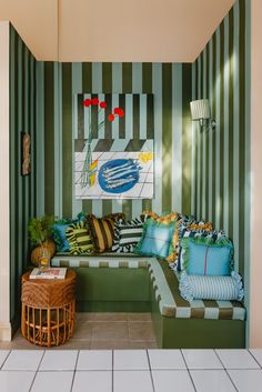 a living room with green and white striped walls