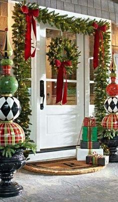 christmas decorations on the front porch of a house